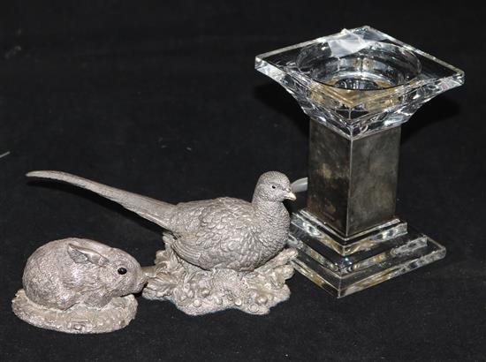 Two silver overlaid animal groups and a silver mounted glass candle holder.